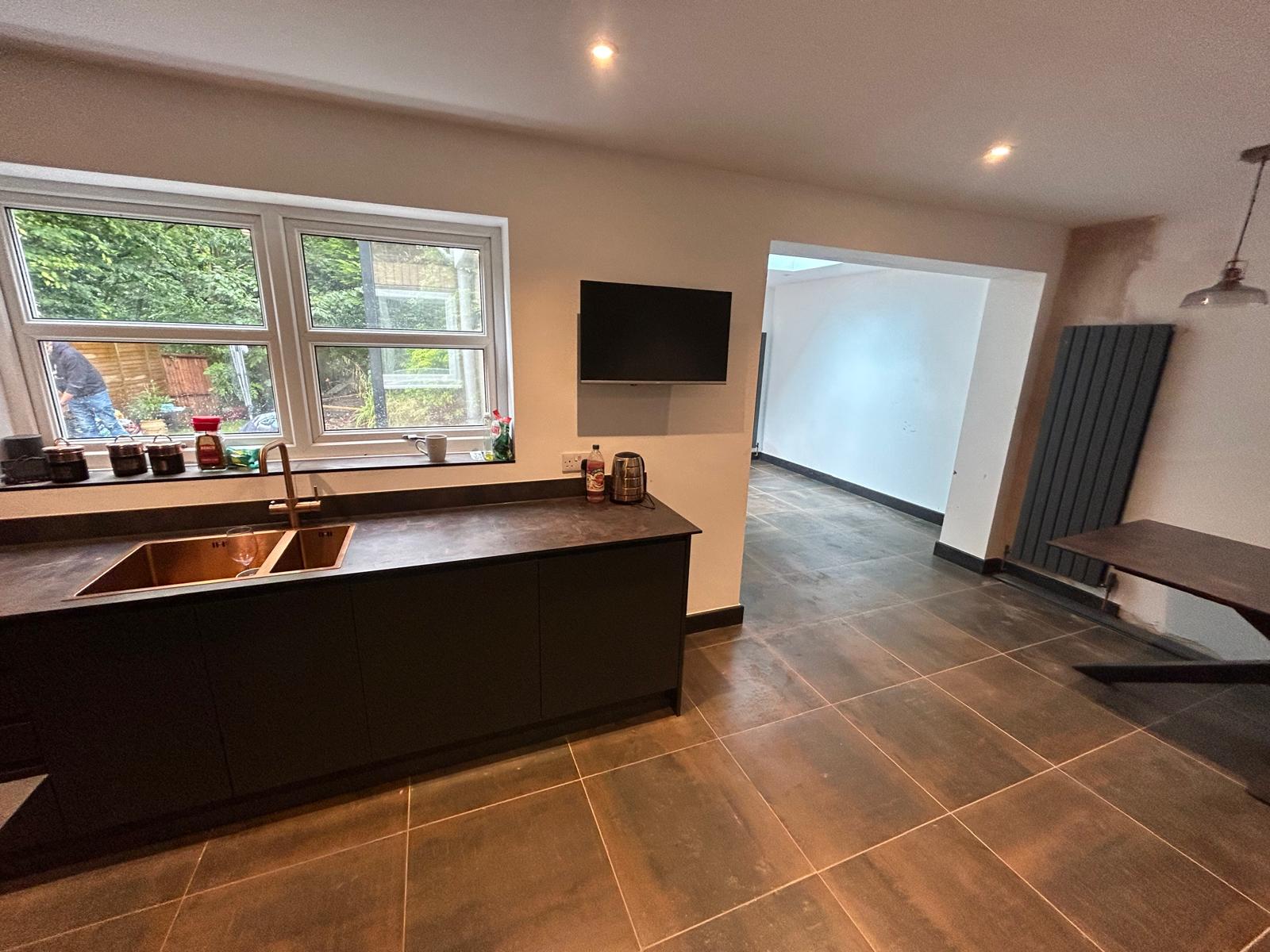Dark Graphite Handleless Kitchen with Porcelain Worktops